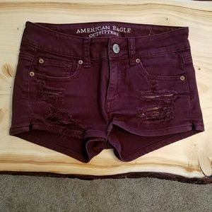 Burgundy shorts.